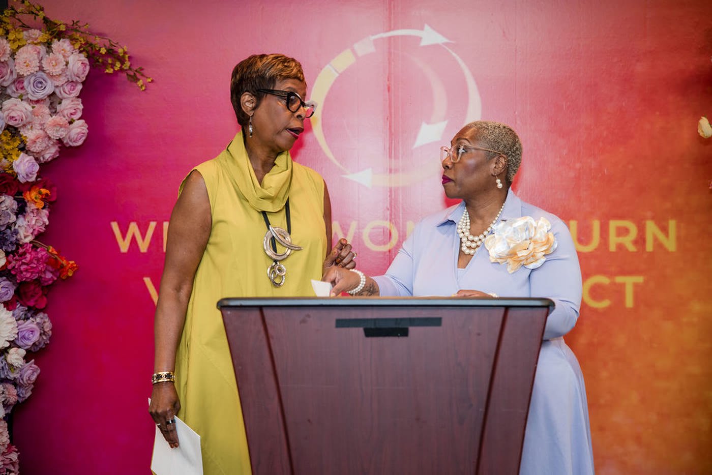 Two speakers at a podium during a civic leadership event