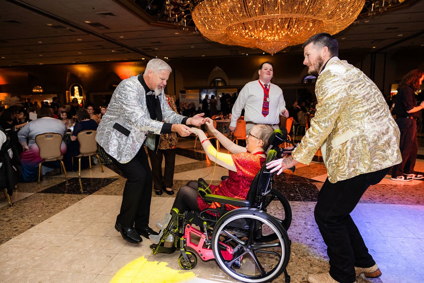 Guests dancing beneath the chandelier at the Children's Cancer Foundation 40th Annual Gala